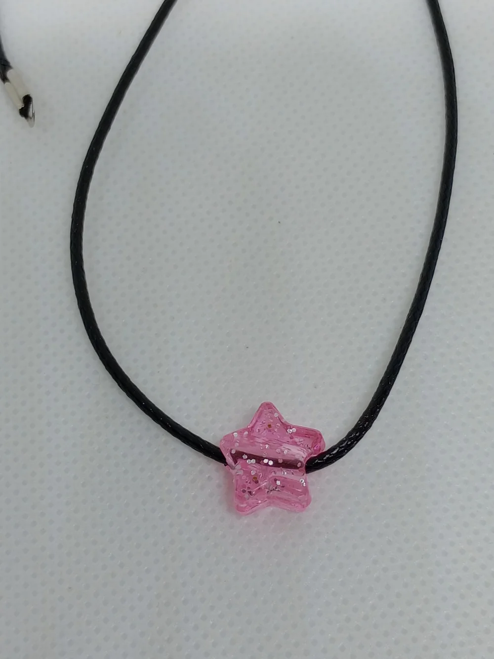 Pink Star Pendant on Black Cord Necklace
